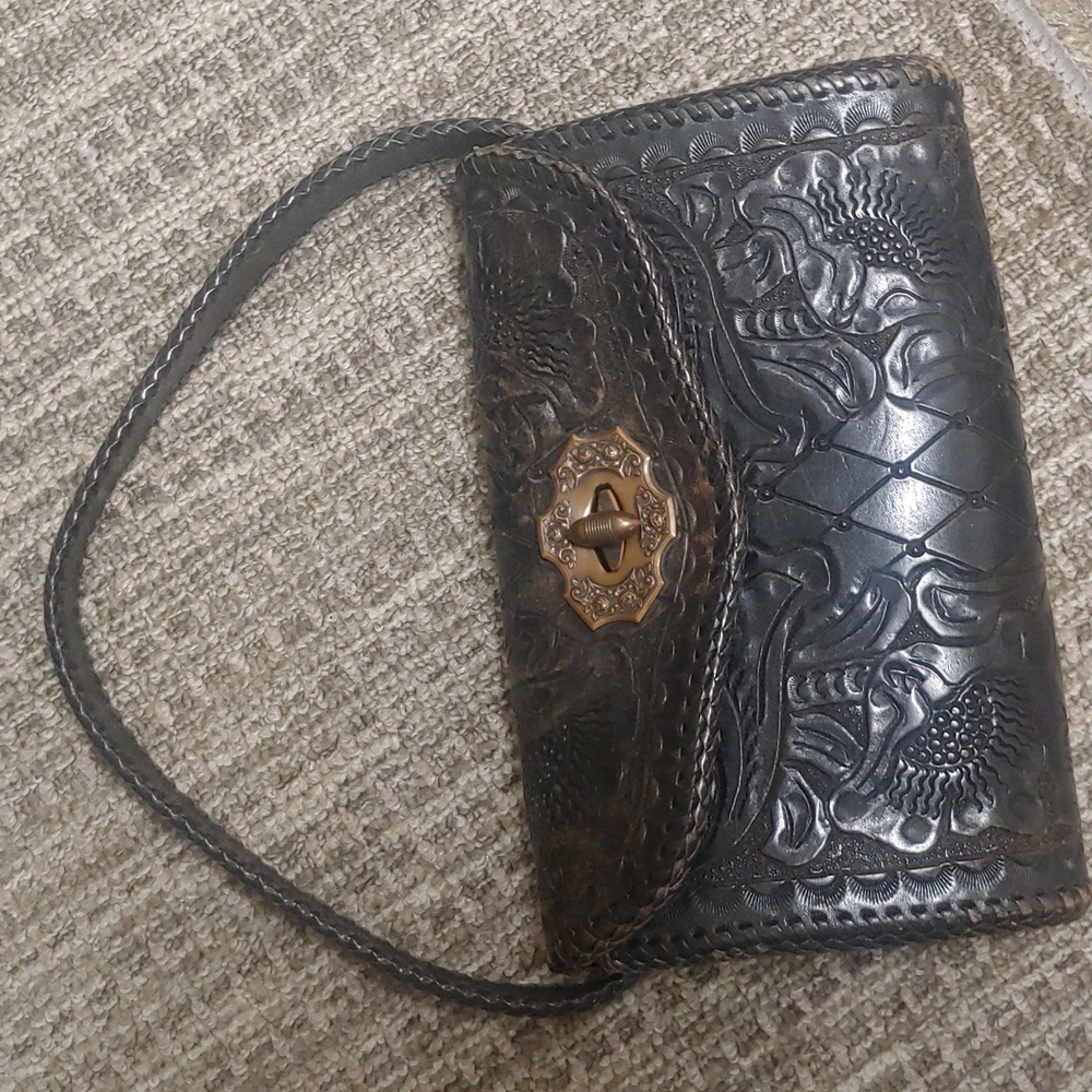 Vintage tooled, distressed saddle leather bag with heavy duty Copper hardware